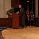Professor Louis Moore at podium